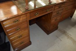 A Victorian mahogany kneehole desk or dressing table, stamped Maple & Co, width approx. 122cm