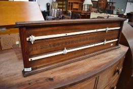 A traditional woodframe snooker scoreboard