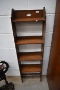 A late 19th or early 20th Century oak narrow bookshelf