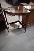 An Edwardian mahogany and inlaid corner jardiniere stand