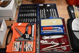 A staple gun and staples, sets of scalpels and similar.