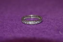 A white metal and paste full eternity ring stamped sil,size 0