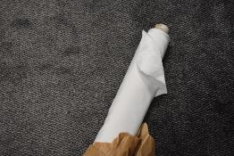A roll of haberdashery or dress making fabric in white satin