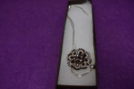 A modern three strand style white metal necklace by Silpada and a brooch