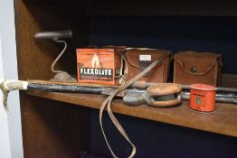 A selection of hardware including walking sticks and cameras etc