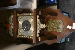 A reproduction 8 day wall clock weight driven