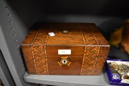 A trinket case having decorative mosaic style veneer inlay