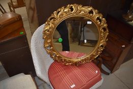 A reproduction gilt effect framed mirror