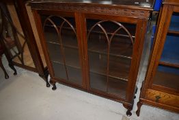 An early 20th Century mahogany glazed bookcase or display cabinet, width approx. 107cm