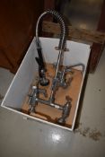 A vintage chrome mixer tap and a pair of classical York taps