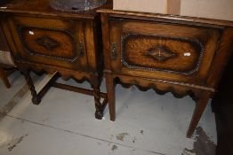 A matched pair of early 20th Century oak bedside pot cupboards, one having twist and one having