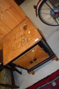 A vintage cabinet having Snoopy and Woodstock marquetry inlay to top
