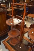 An early 20th Century mahogany folding cake stand