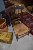 A Victorian provincial style rush seated kitchen chair (possibly cut down)