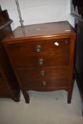 An early 20th Century mahogany four drawer music cabinet