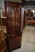A reproduction Regency mahogany effect corner display