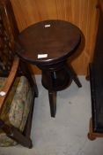A stained frame adjustable stool