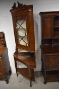 A Victorian oak corner display on stand