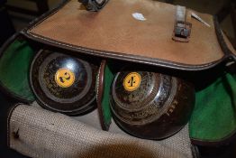 A set of four vintage Jaques lignum vitae bowls, Bias number 3, in bag