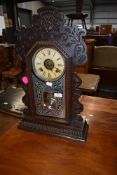 A Victorian stained frame American style mantel clock