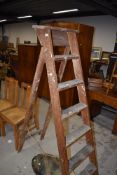 A set of vintage wooden stepladders