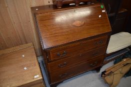 An early 20th century inlaid mahogany bureau