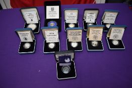A collection of GB Silver Proof £1 Coins and Silver Britania's with certificates in cases, £1