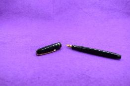 A Mabie Todd & Co Swan Leverless twist filler, in black with a single band to cap and a Swan No1K
