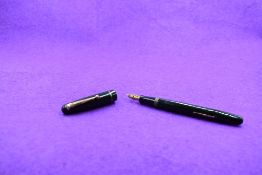 A Mabie Todd & Co Swan 3140 Self filler leverfill in green, single band to cap, with Swan No1 nib.