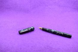 A Mabie Todd & Co Blackbird 5242 Self filler Leverfill fountain pen, in light blue/dark blue marble,