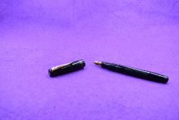 A Mabie Todd & Co Swan L212/60 Leverless twist filler, in black with two bands to cap and a Swan No2