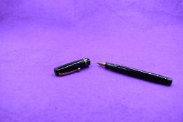A Mabie Todd & Co Swan Leverless twist filler, in black with two bands to cap (cap missing screw