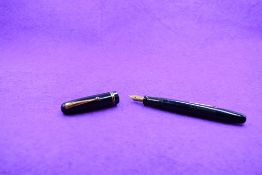 A Mabie Todd & Co Swan 3220 Self Filler Leverfill, in dark blue with two bands to the cap and a Swan