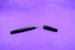 A Mabie Todd & Co Swan L112/60 Leverless twist filler, in black with two bands to clipless cap and a