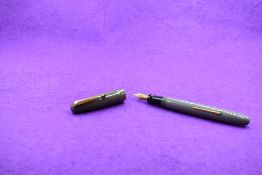 A Mabie Todd & Co Swan Self Filler Leverfill, in grey with two bands to the cap and a Swan No2