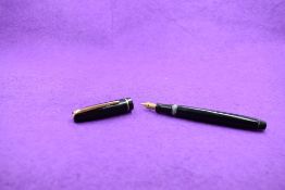 A Mabie Todd & Co Swan Leverless twist filler, in black with a single band to cap and a Swan No2