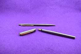 A Montblanc Noblesse fountain pen and ballpoint pen set in brushed steel having a 585 nib. 14.3cm