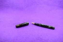 A Mabie Todd & Co Blackbird Self filler Leverfill fountain pen, in green marble, a Blackbird nib.