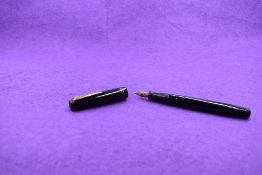 A Mabie Todd & Co Swan L212/60 Leverless twist filler, in black with two bands to cap and a Swan No2