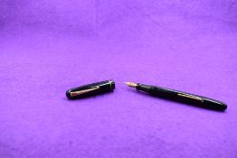 A Mabie Todd & Co Swan 3160 Self filler leverfill in black, single band to cap, with Swan No1 nib.