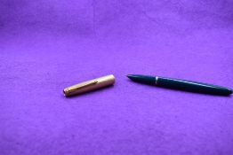 A Parker 51 in turquoise with a rolled gold cap
