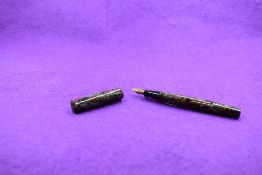 A Mabie Todd & Co Blackbird Self filler Leverfill fountain pen, in grey, black and red marble,