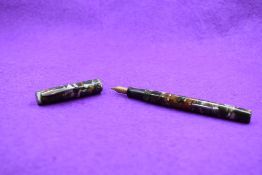 A Watermans 32 leverfill fountain pen in Orange and Grey marble, single narrow band to cap and