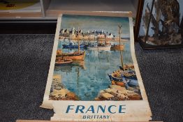 A vintage early 20th century advertising poster for the French Railways having tears and partial