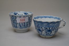 A Chinese export hard paste tea bowl having six hand decorated panels with floral and butterfly /