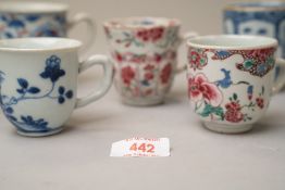 A selection of antique Chinese export hard paste tea or chocolate cups all being hand decorated in