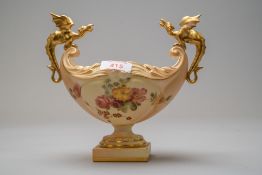 A Royal Worcester dragon boat or fruit bowl having a footed base with hand decorated floral work