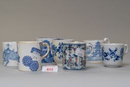 Seven blue and white wear antique tea or coffee cups in various designs including hard paste and