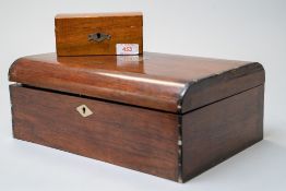 A Victorian jewellery case having rose wood case with ebony banding and a fitted interior in two