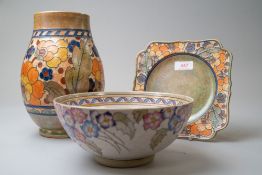Three pieces of art deco design ceramics including an Arabesque bowl by Charlotte Rhead, a plate